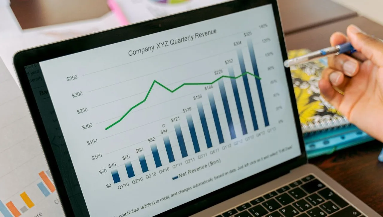 Laptop screen showing business analytics and revenue charts